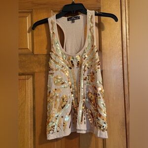 Light pink shirt w/ tan and brown sequins on the front. Size M. Great condition